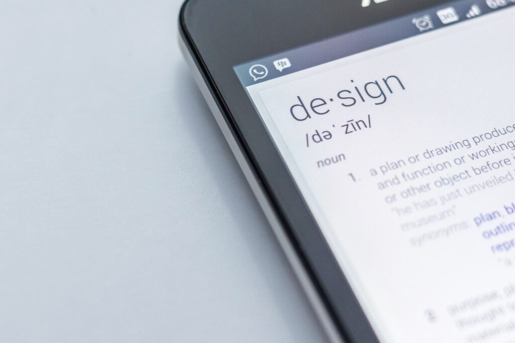 Smart Mobile Phone displaying the definition of the word DESIGN.