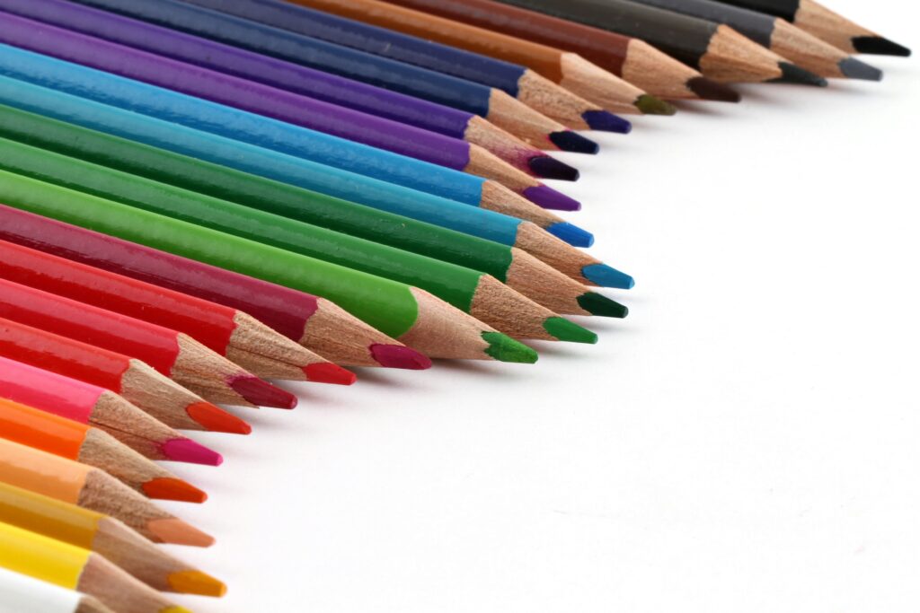 Bunch of different color pencils spread on a table