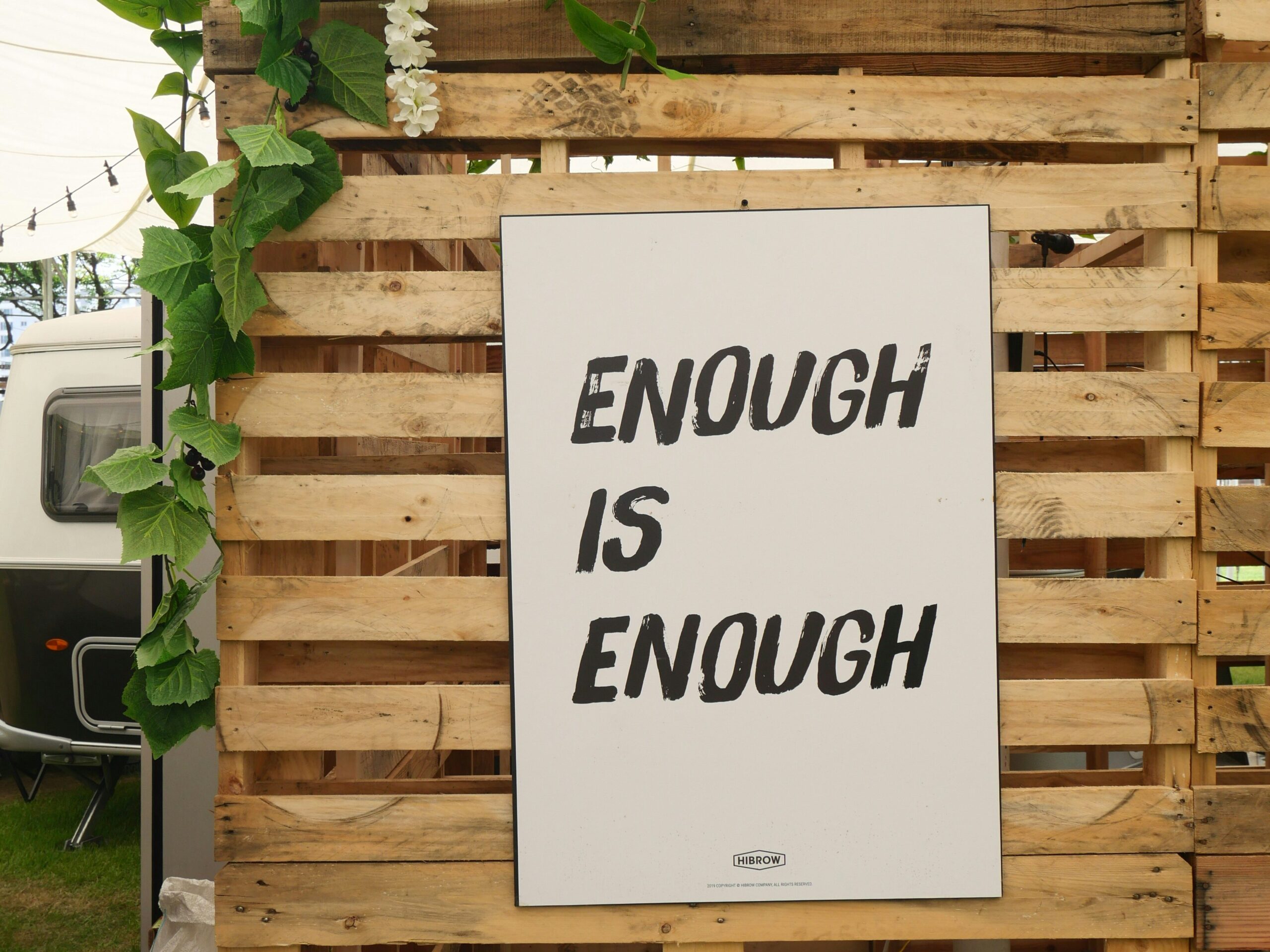 Board with the lettering that reads "Enough is Enough"